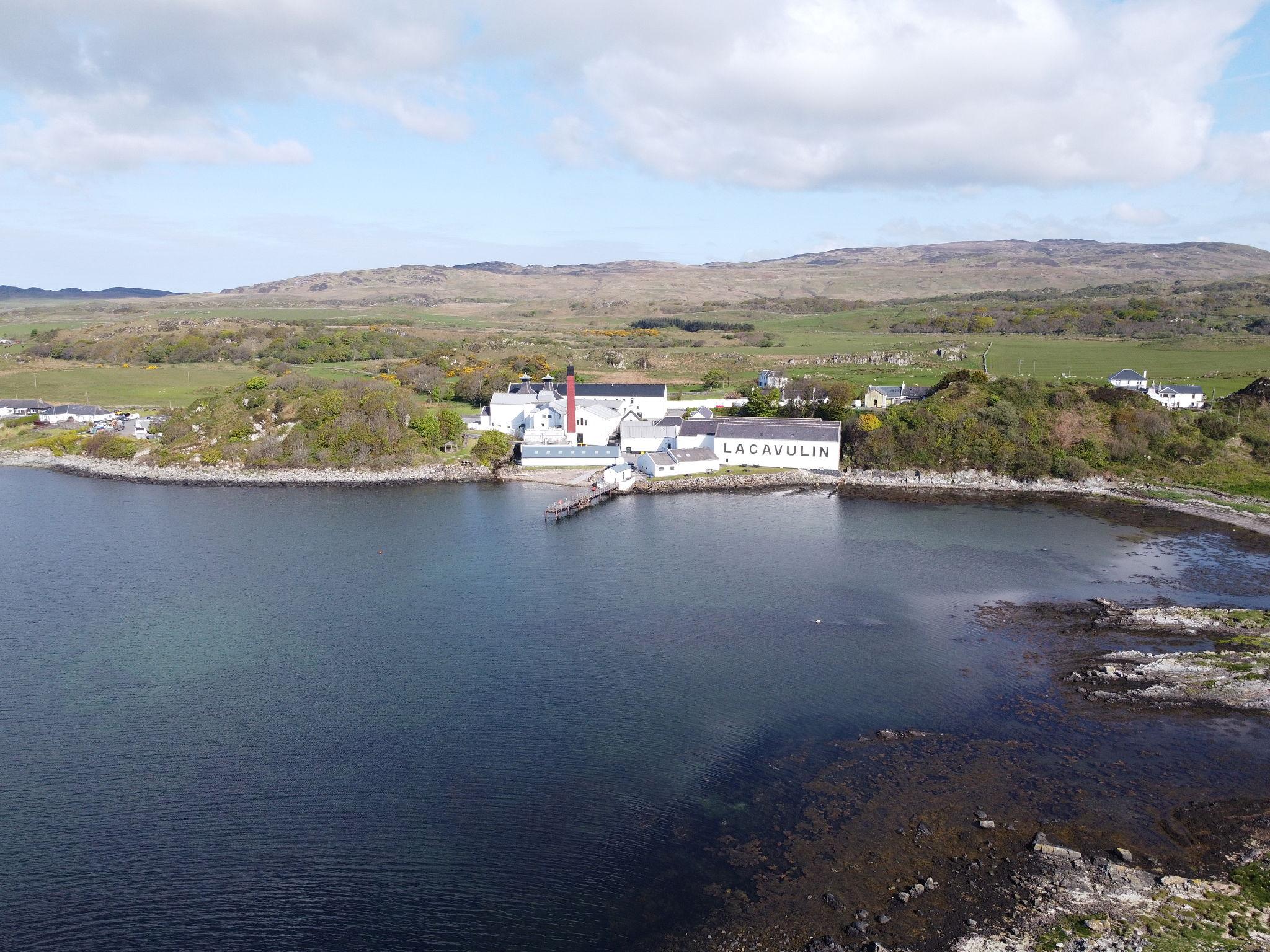 Lagavulin distillery buildings on the Islay coastline with surrounding landscape